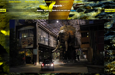 Une projection du papillon jaune Conte-Acteurs a été faite sur l'éléphant des Machines de l'Ile à Nantes.